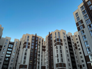 Naklejka premium Modern apartment buildings with large windows and air conditioning units