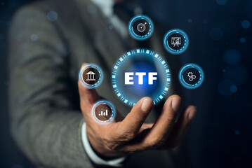 ETF. Exchange traded fund stock market trading investment financial concept on hand. Business...