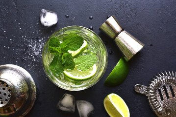 Mojito - cold summer lemonade with lime and mint .Top view with copy space.