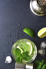 Mojito - cold summer lemonade with lime and mint .Top view with copy space.