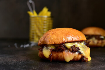 Homemade burger with pulled pork , caramelised onion and smoked bacon.