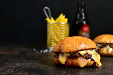 Homemade burger with pulled pork , caramelised onion and smoked bacon.
