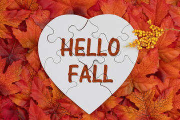 Hello Fall on puzzle heart with fall leaves