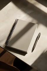 clean desktop with refillable notebook and eco pen
