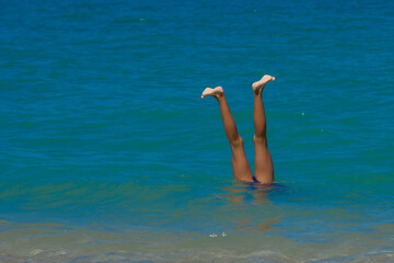 Funny feet sticking out of the water