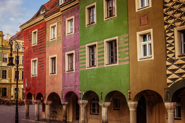 A row of vividly painted townhouses in Poznań’s Old Market Square showcases the charm of Polish...