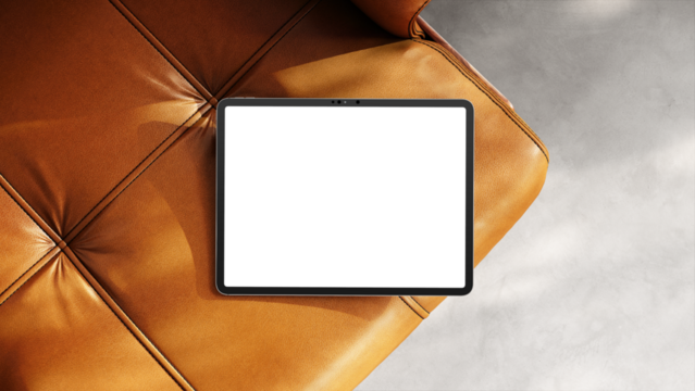 Blank tablet screen resting on a leather chair with soft shadows for web design and UX/UI presentation.