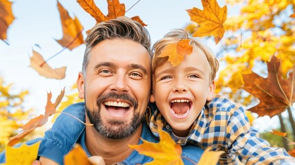 Joyful Father and Son Laughing in Autumn Leaves Outdoors