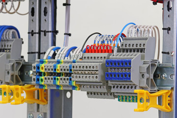Electrical terminals with connected insulated copper wires with metal lugs. Marking with a thermal printer. 