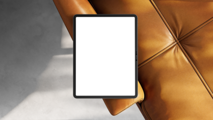 iPad mockup with transparent screen on a leather sofa for web design and UX/UI mockups. Sunlight with shadows.
