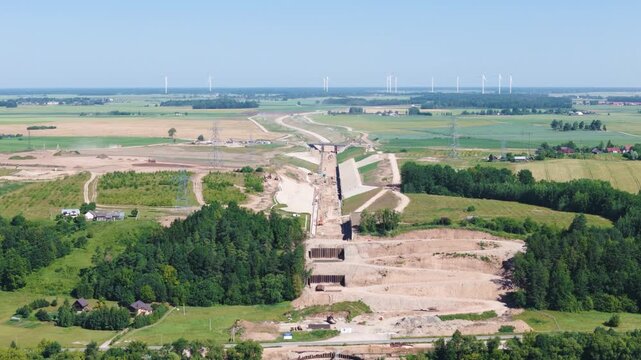 Railway construction project over farmland fields of Lithuania, aerial view