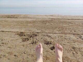 Relaxing Beach View – Barefoot on Sand Looking at the Sea