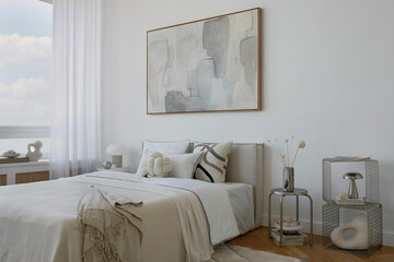 Contemporary bedroom in beige and white tones with mock up abstract wall art, modern lighting and carefully curated accessories.