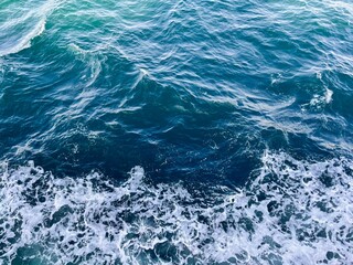 Top View of a Ship's Wake on the Blue Sea