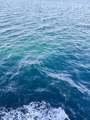 Rippled Blue Water Surface with a Ship's Wake