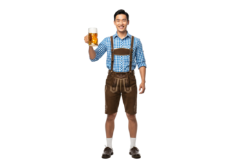 PNG cut out isolated background. A full-length portrait of a smiling young Asian man wearing traditional Bavarian lederhosen and holding a large glass mug of beer, celebrating Oktoberfest 