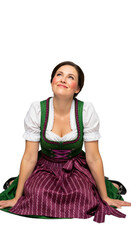 PNG cut out isolated background. A beautiful young woman with rosy cheeks and braided hair, wearing a traditional Bavarian dirndl dress. She is sitting on the floor and smiling happily.