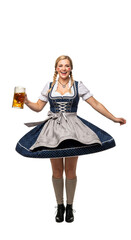 PNG cut out isolated background. A full-length portrait of a happy young woman in a traditional Bavarian dirndl dress, holding a large glass mug of beer to celebrate Oktoberfest.