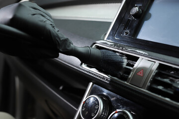 Fototapeta premium Staff use microfiber cloth to clean cars at car care shop.