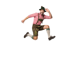 PNG cut out isolated background. An energetic man in traditional Bavarian attire jumps for joy at Oktoberfest.

