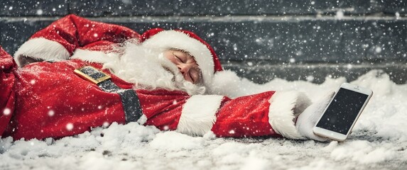 Tired Santa sleeping in snow