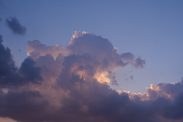 Dramatic Evening Clouds Illuminated by Warm Sunset Light