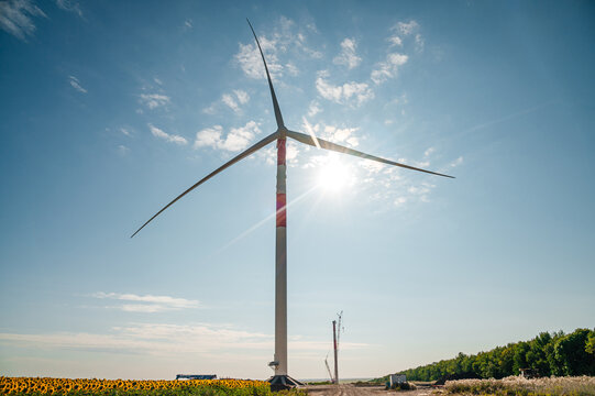 wind turbines in the wind park under construction in the Samara region in the sunflower field