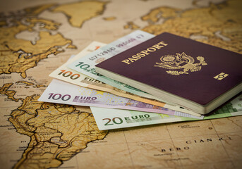 Passport and euro currency on world map for international travel