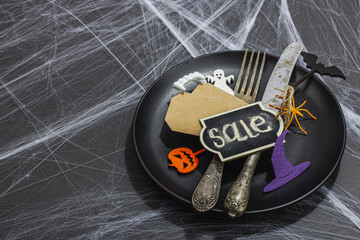 Table setting, traditional festive composition for Halloween party. Funny seasonal props