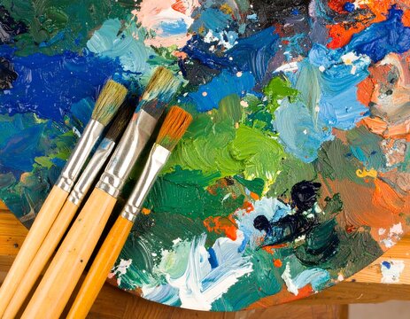 Artist's palette with paint and brushes