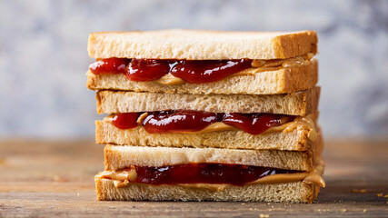 Stack of toasted bread with strawberry jam filling, delicious breakfast sandwich close-up, isolated on white.