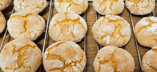 Golden crinkle cookies cooling on a wire rack whisper cozy autumn nostalgia, perfect for World Baking Day celebrations