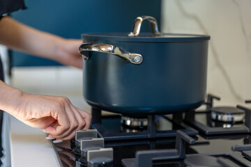 Turning on stove. Cooking start. Kitchen ritual