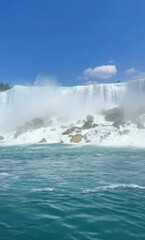 Cascading turquoise waterfall, ethereal mist, natural symphony of earth's vitality, World Water Day celebration, majestic Aquamarine Daydream