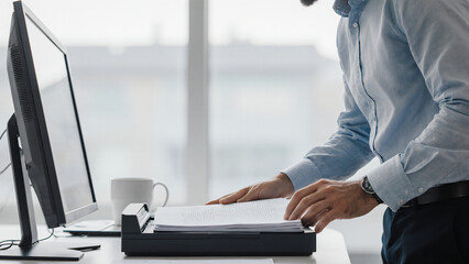 Man scanning files with document scanner 