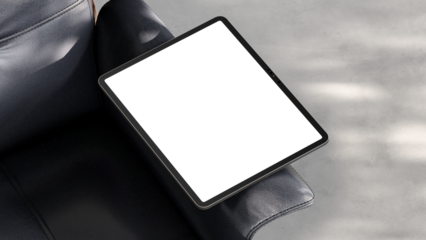 Blank tablet screen resting on a leather chair with soft shadows for web design and UX/UI presentation.