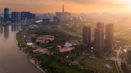 Aerial view of early morning in Ho Chi Minh City, Vietnam with development buildings, transportation, energy power infrastructure. Financial and business centers