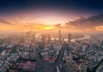 Aerial view of early morning in Ho Chi Minh City, Vietnam with development buildings, transportation, energy power infrastructure. Financial and business centers