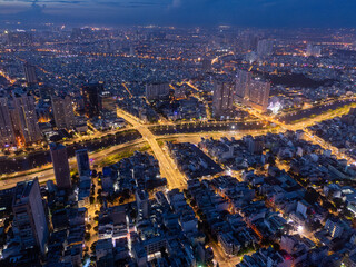 Obraz premium Aerial view of early morning in Ho Chi Minh City, Vietnam with development buildings, transportation, energy power infrastructure. Financial and business centers