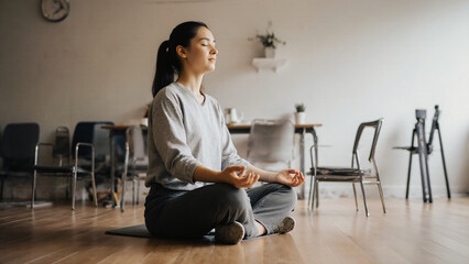 Employee meditating in break room 