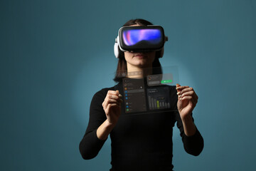 Woman Using Virtual Reality Headset and Touching Futuristic Transparent Dashboard Interface