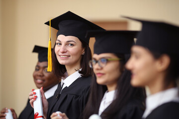 Group, students and diversity at college graduation, happiness for degree or diploma certificate....