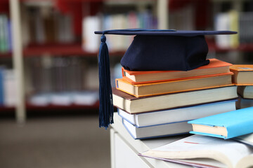 Students browsing a book in the library or bookshop, exam preparation, teacher training, higher education, e-learning for students, research project work for masters, bachelors, internships