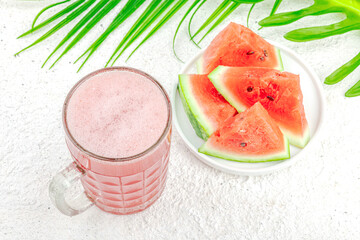 Trendy watermelon beer. Traditional Oktoberfest drink, kvass with palm leaves. Modern beverage