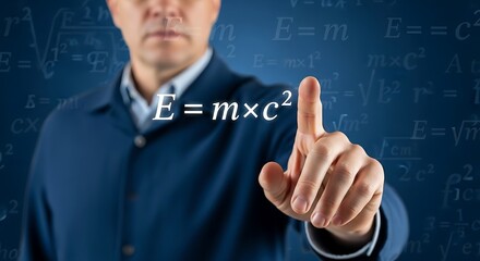 A hand pointing to the equation E=mc?.