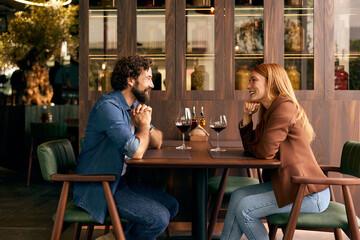 Couple Enjoying a Romantic Dinner at a Cozy Restaurant