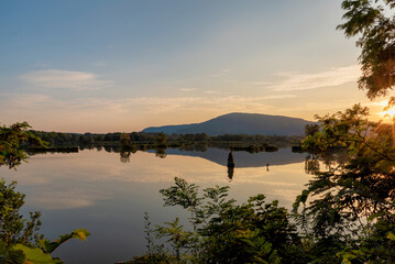 Lake view at sunrise with mountain reflection