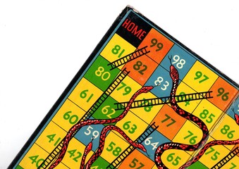 Detail from a vintage snakes and ladders game board.