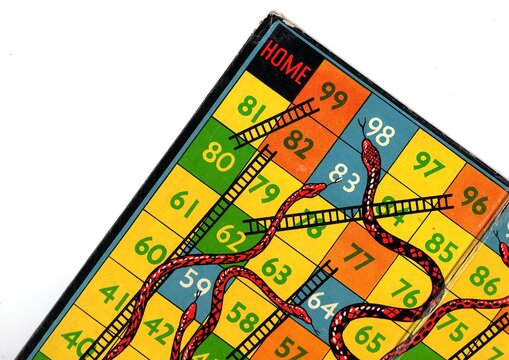 Detail from a vintage snakes and ladders game board.