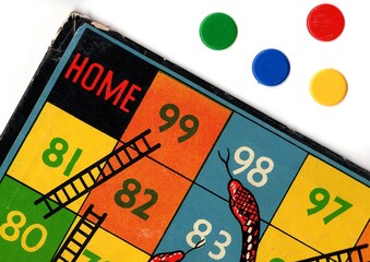 Detail from a vintage snakes and ladders game board.